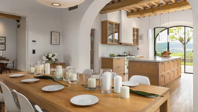 The dining and kitchen space at one of the villa properties at Casali di Casole, a Timbers Resort estate in Italy. Photo Credit: Courtesy of Timbers Co.

